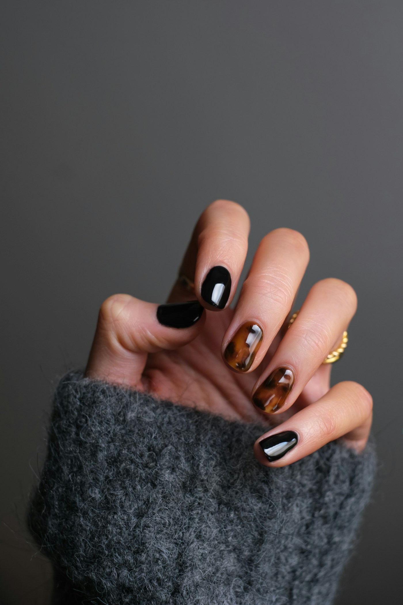 Manicure in progress with refined nude polish